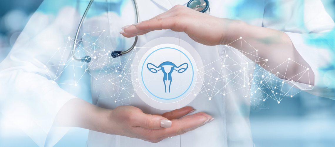 The doctor protects the uterus on a blue background.